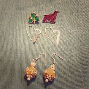 Two sets of earrings plus two pins